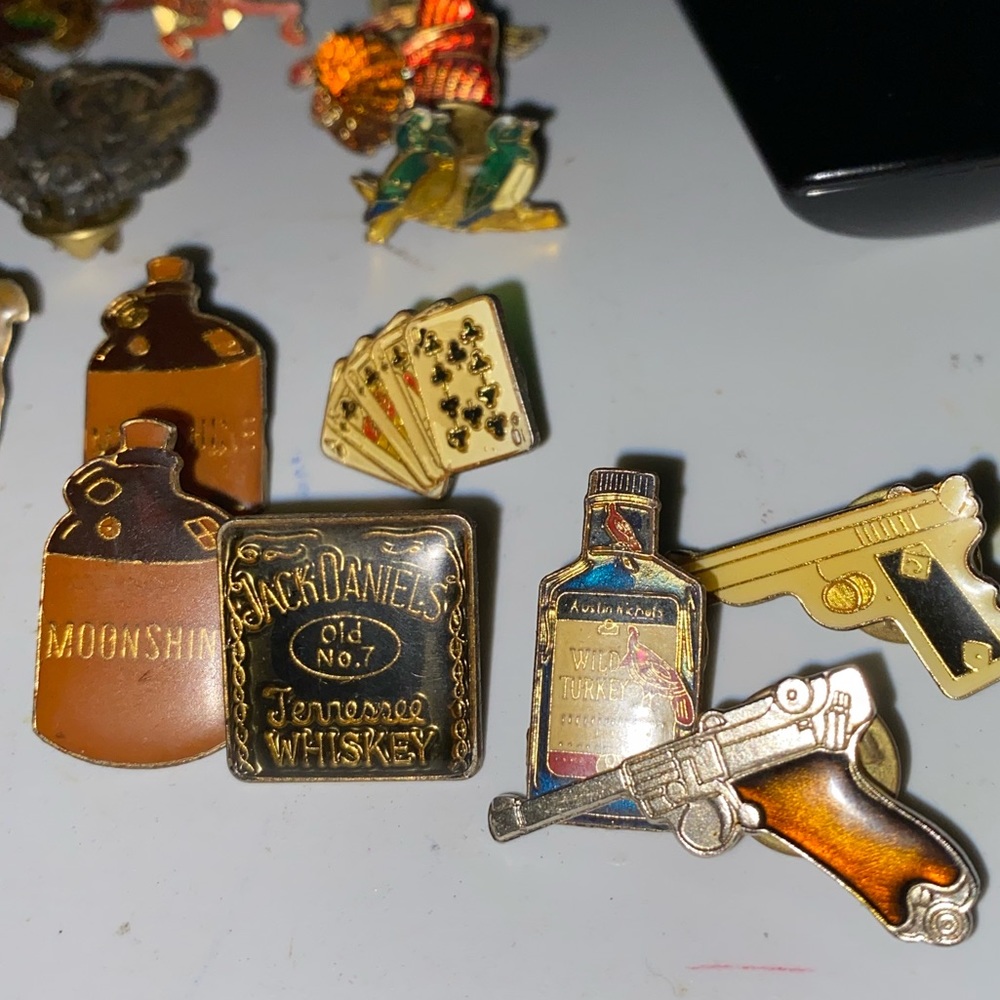 58 older Different Pins with backs. Splinter is the only pin with marks on back.
